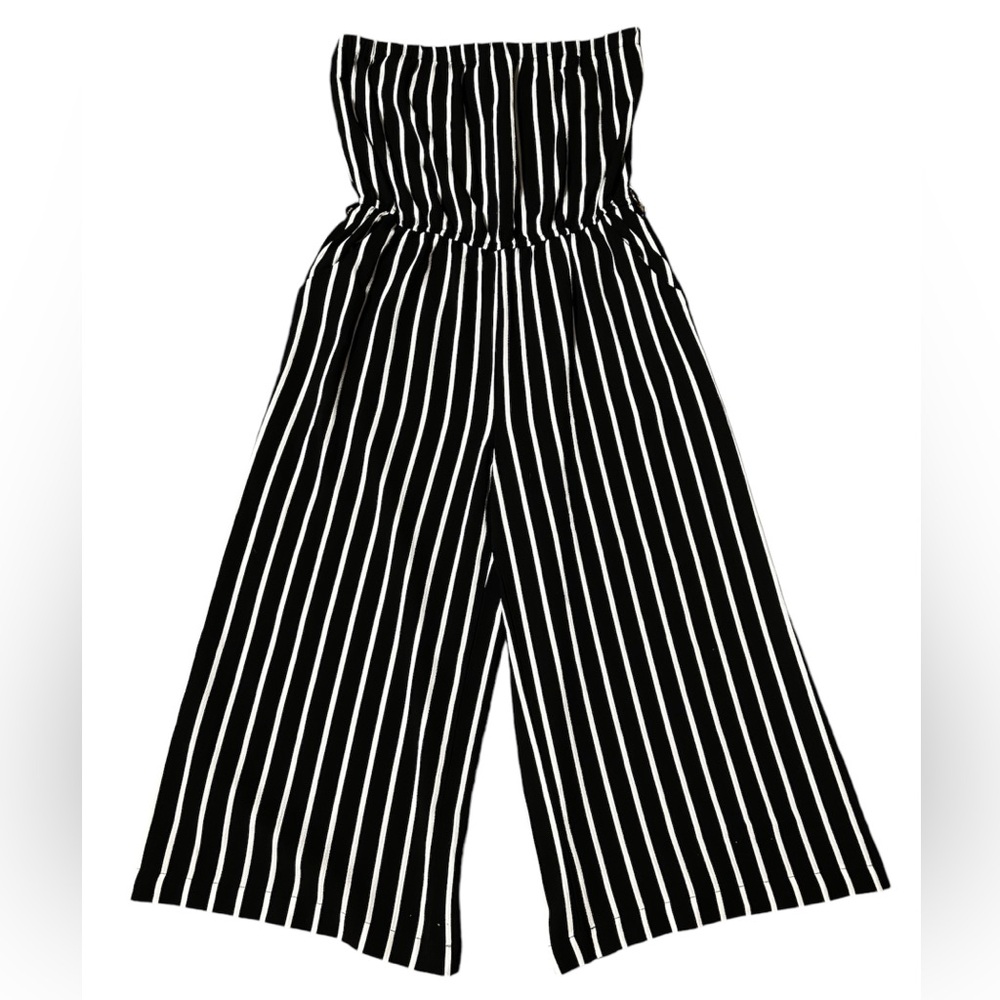 Black and white striped jumpsuit with flared leg and strapless top